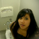 A girl is video recorded taking a shit in a public restroom. No pooping sounds can be heard, and the scene is somewhat brief.